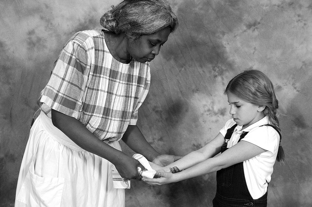 Alicia Jones plays Calpurnia and Nava Ruthfield plays Scout in Edmonds Driftwood Players’ “To Kill A Mockingbird” through Feb. 25. (Dale Sutton / Magic Photo)