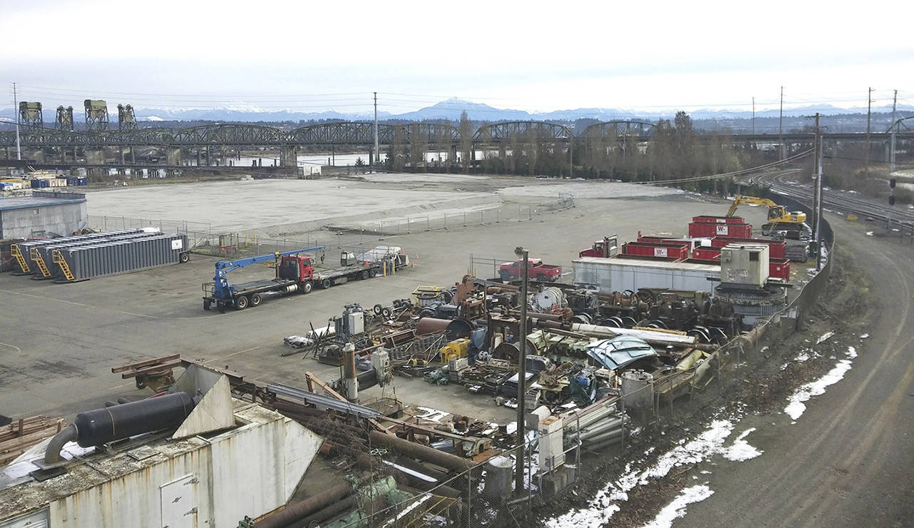 The bluff on E. Marine View Drive overlooks the industrial site where a warehouse burned down in June 2016. The property continues to have oversight problems. (Rikki King / The Herald)