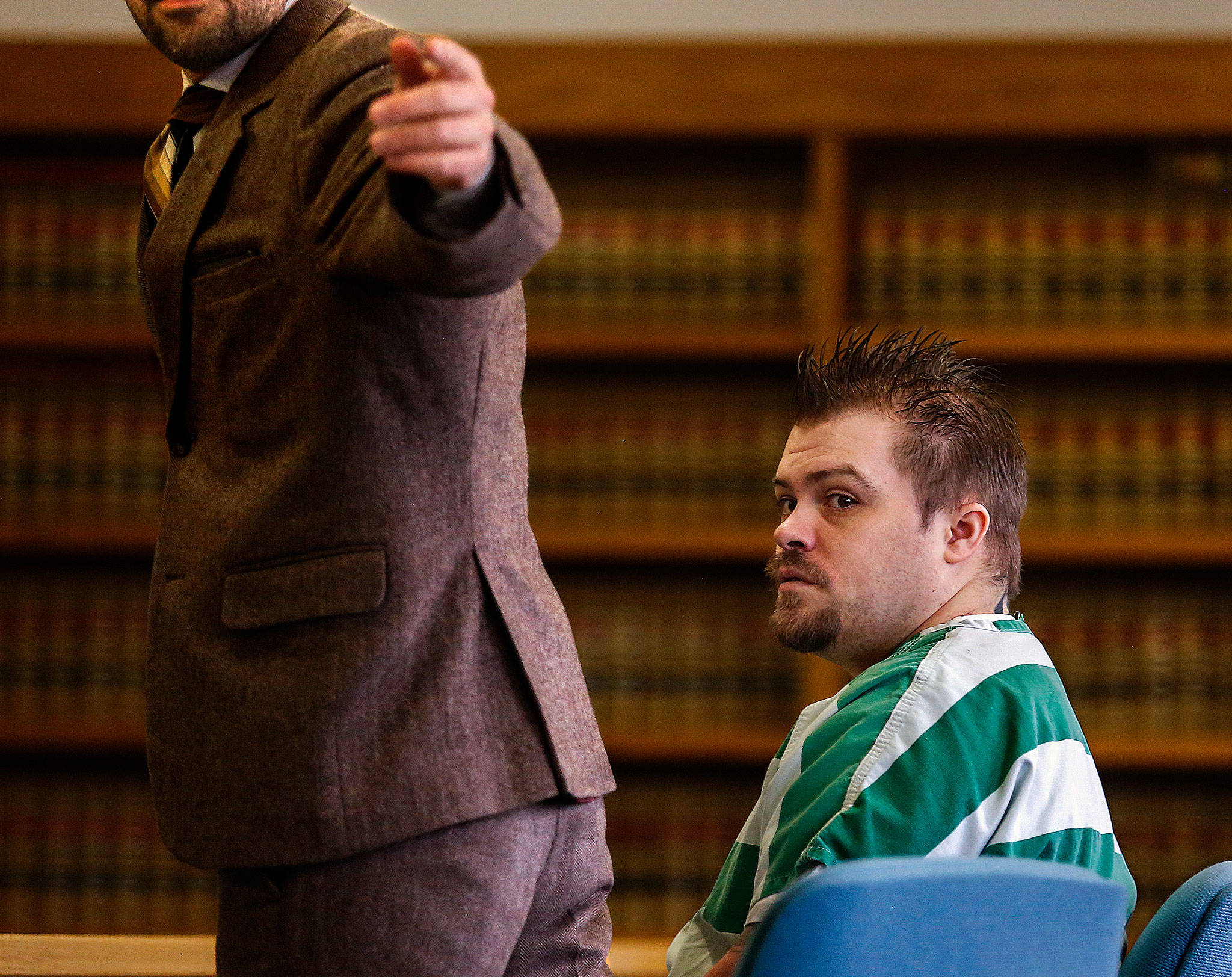 Public defender Jason Schwarz (left) directs a courtroom deputy as he and convicted violent rapist Daniel Miltenberger prepare to approach the bench during Miltenberger’s sentencing hearing Tuesday before Snohomish County Superior Court Judge Linda C. Krese. (Dan Bates / The Herald)