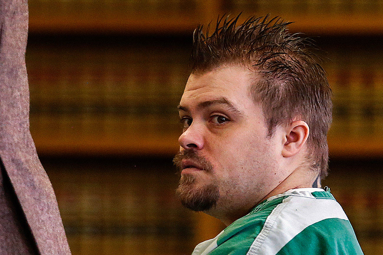 Public defender Jason Schwarz (left) directs a courtroom deputy as he and convicted violent rapist Daniel Miltenberger prepare to approach the bench during Miltenberger’s sentencing hearing Tuesday before Snohomish County Superior Court Judge Linda C. Krese. (Dan Bates / The Herald)