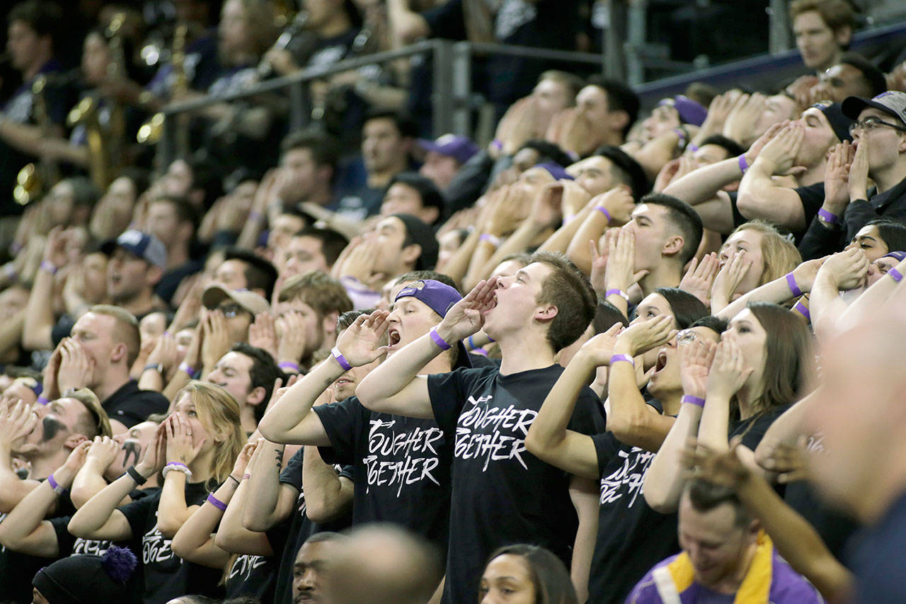 Washington’s student section, nicknamed The Dawg Pack, cheers during the second half of the Huskies’ 78-75 win over Arizona on Feb. 3 in Seattle. (AP Photo/John Froschauer)