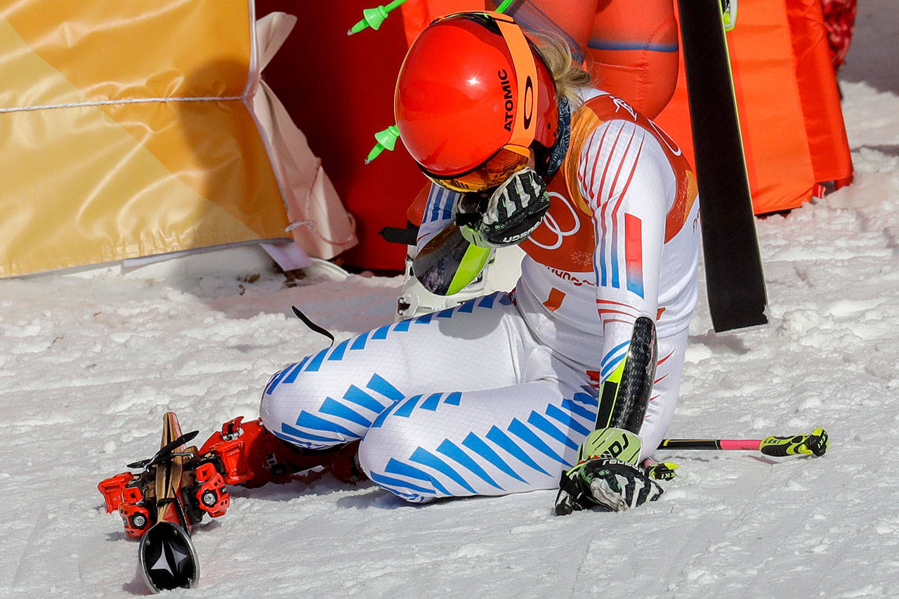Mikaela Shiffrin, of the United States, falls to her knees after winning the gold medal in the Women’s Giant Slalom at the Winter Olympics in Pyeongchang, South Korea, on Feb. 15, 2018. (AP Photo/Michael Probst)