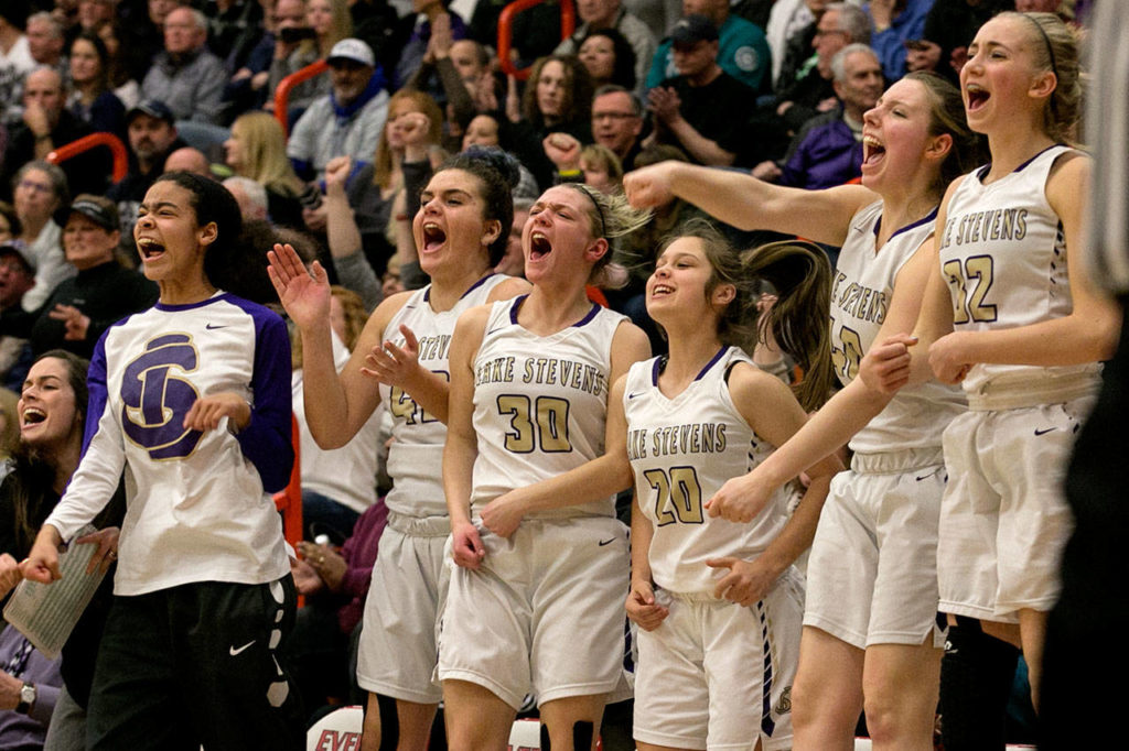 Lake Stevens players celebrate a late score during the 4A district championship game against Glacier Peak on Feb. 15, 2018, at Everett Community College. (Kevin Clark / The Herald)

