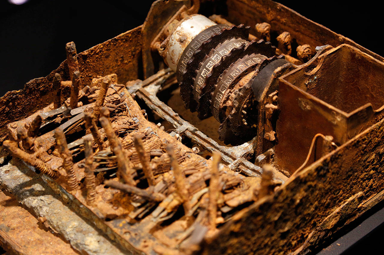 An “Enigma” machine destroyed by German troops in the field is displayed at SPYSCAPE in New York. Visitors to a new attraction opening in New York City can learn about the elements of spying, its history and find out what kind of spy they could be. SPYSCAPE opens Friday. (Seth Wenig / Associated Press)
