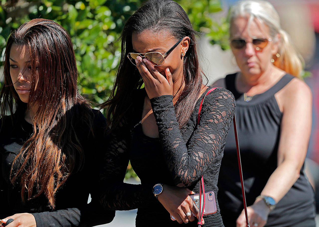Mourners leave the funeral of Meadow Pollack, a victim of the Wednesday shooting at Marjory Stoneman Douglas High School, in Parkland, Florida, on Friday. (AP Photo/Gerald Herbert)