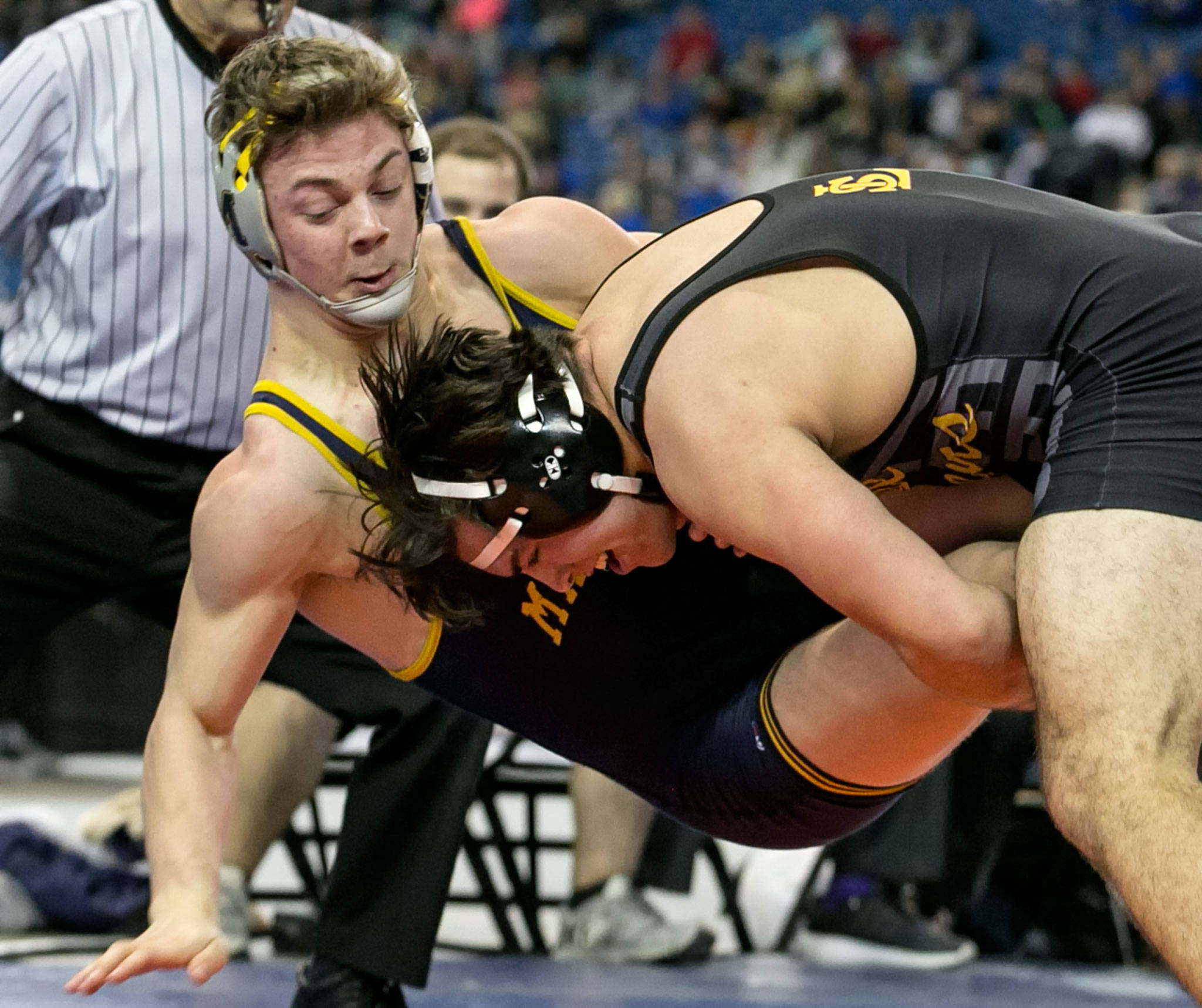 Lake Stevens’ Malachi Lawrence (right) takes down Mariner’s Levi Weaver in the 4A 182-pound championship bout at Mat Classic XXX on Feb. 17, 2018, at the Tacoma Dome. (Kevin Clark / The Herald)