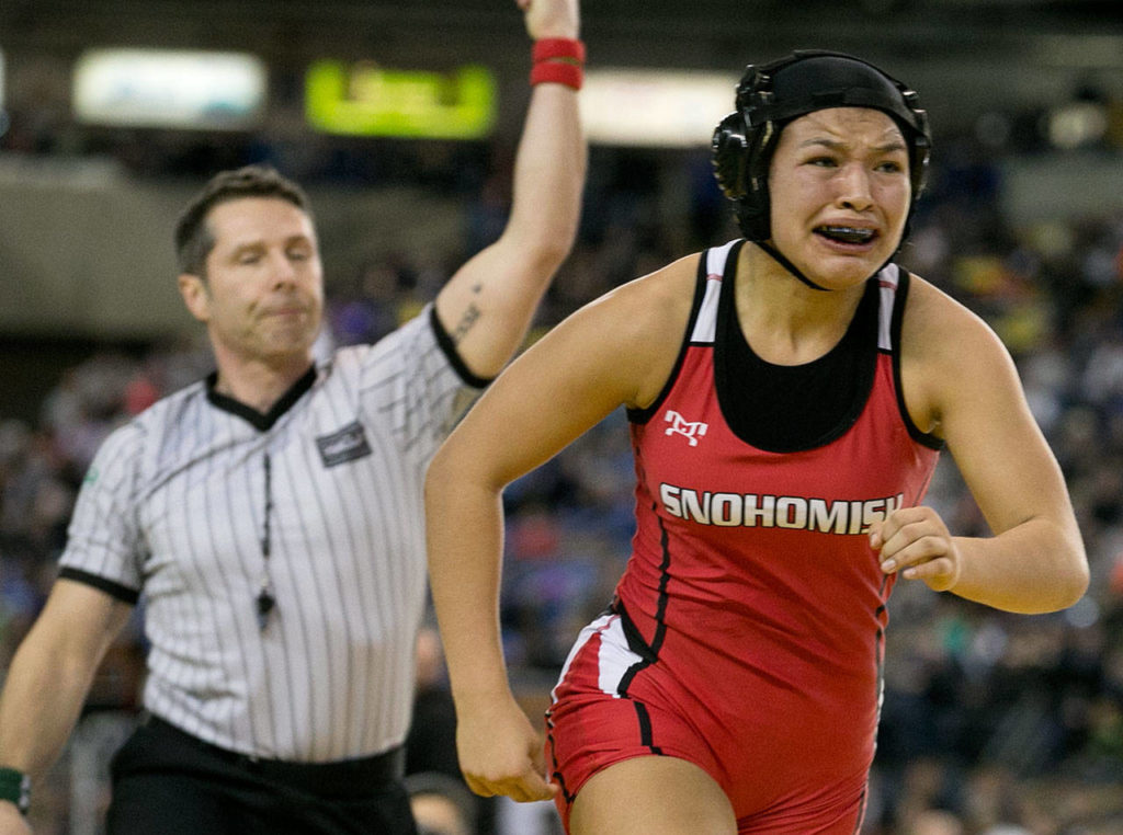 Snohomish’s Joessie Gonzales is overcome with emotion after winning the girls 130-pound championship bout at Mat Classic XXX on Feb. 17, 2018, at the Tacoma Dome. (Kevin Clark / The Herald)
