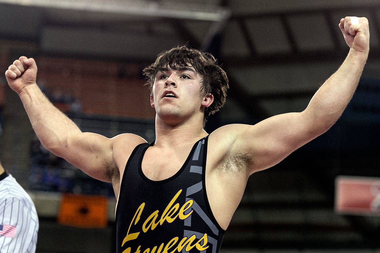 Lake Stevens’ Malachi Lawrence celebrates his 182 weight championship in the 30th Annual Mat Classic Saturday night at the Tacoma Dome in Tacoma on February 17, 2018. (Kevin Clark / The Daily Herald)