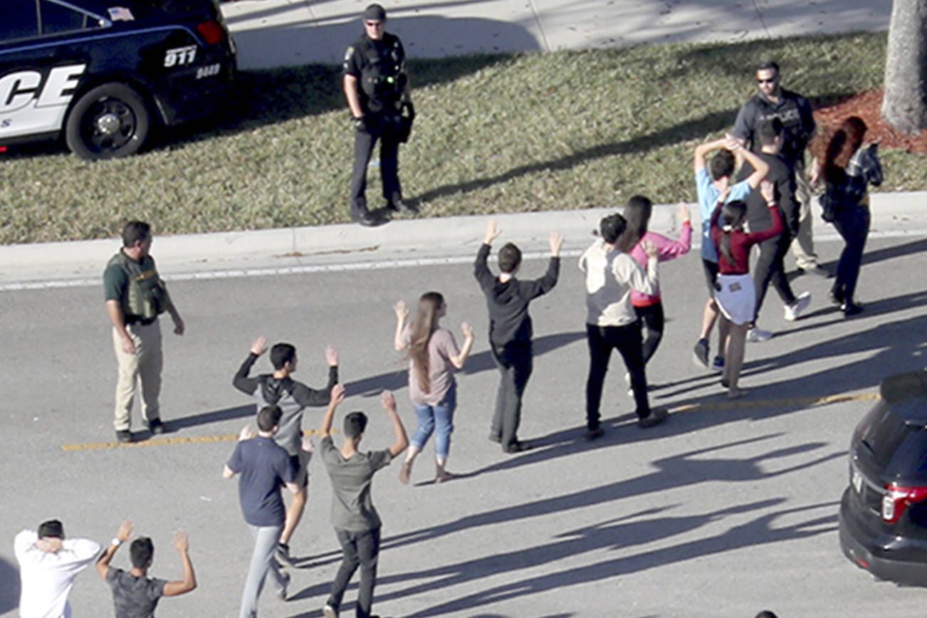 Conundrum of a fire alarm with gunfire: Flee, or lock down?