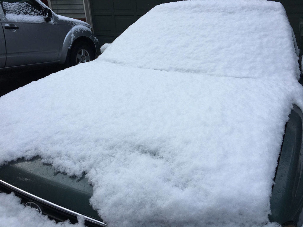 About an inch of snow covers a car in Everett on Sunday, Feb. 18, 2018. About 2 to 4 inches fell. (Ben Watanabe / The Herald)
