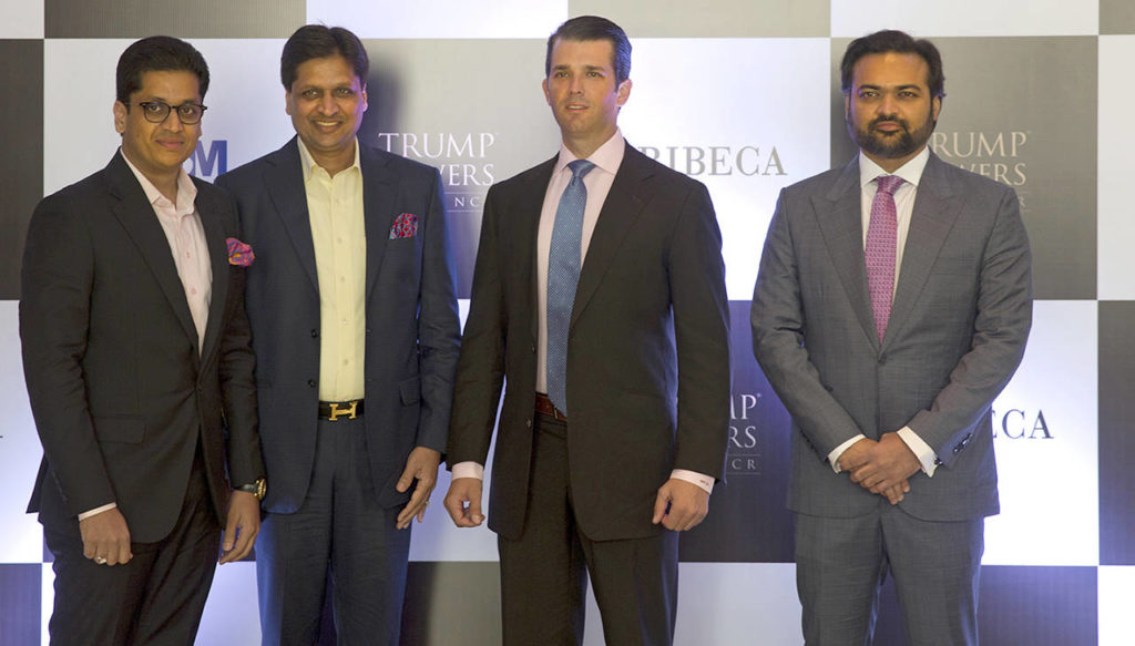 The eldest son of U.S. President Donald Trump, Donald Trump Jr. (second from right), poses with promoters of Trump Towers Pankaj Bansal (left) Basant Bansal of M3M developers and Kalpesh Mehta (right) of Tribeca developers at a photocall in New Delhi, India, on Tuesday. (AP Photo/Manish Swarup)
