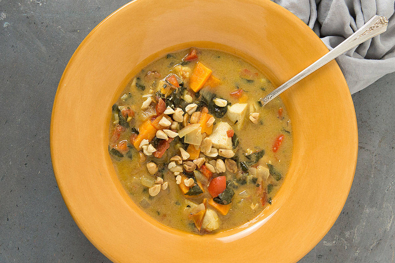 West African peanut stew is made with chicken, sweet potatoes, tomato, bell pepper and collard greens. (Photo by Jennifer Chase for The Washington Post)