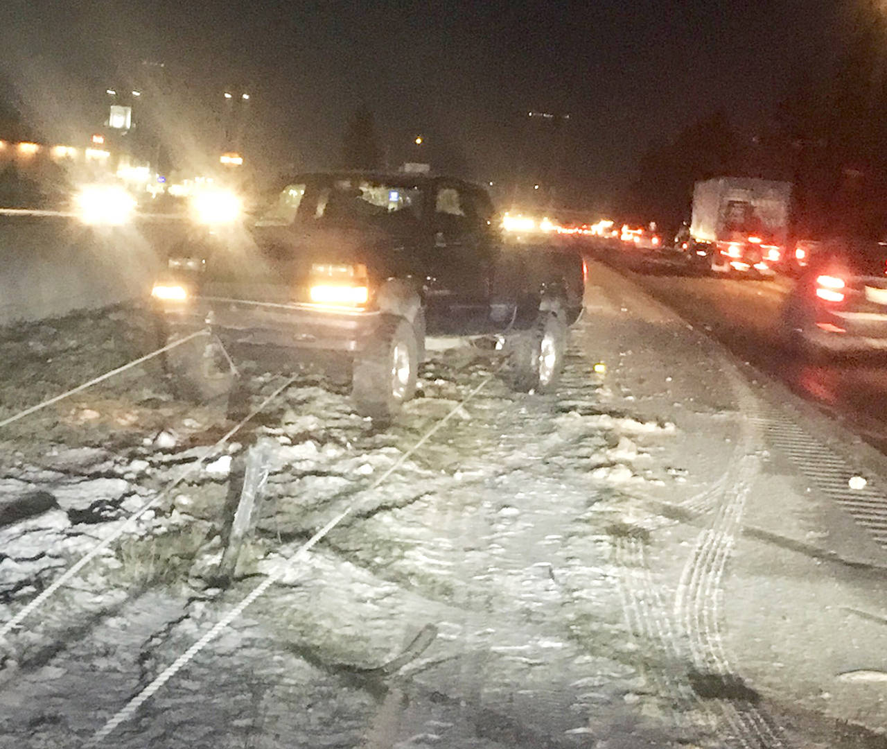 No one was injured when this truck slid into the cable barriers on southbound I-5 on Thursday morning in Smokey Point. (Washington State Patrol)