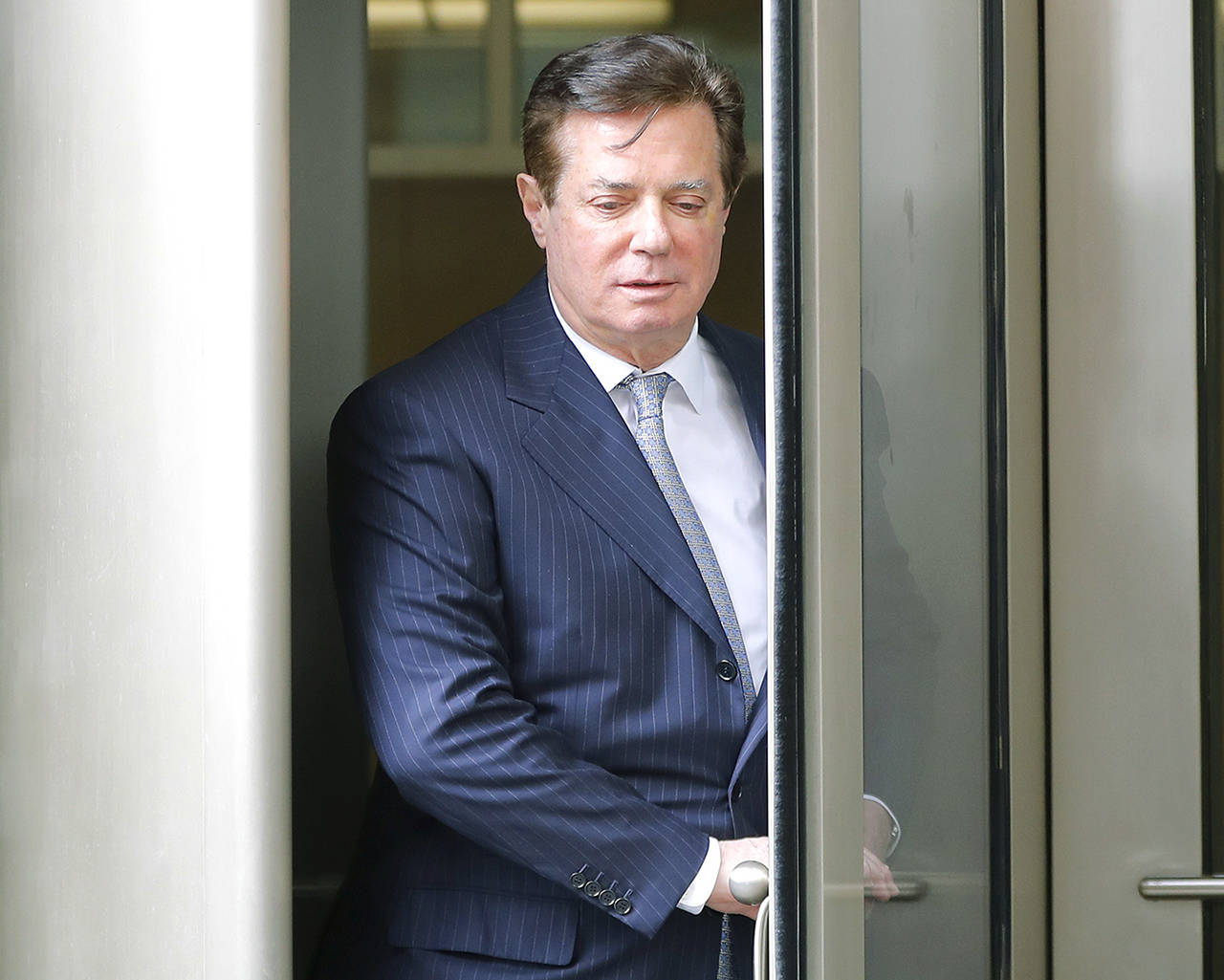 Paul Manafort, President Donald Trump’s former campaign chairman, leaves the federal courthouse in Washington on Feb. 14. (AP Photo/Pablo Martinez Monsivais)