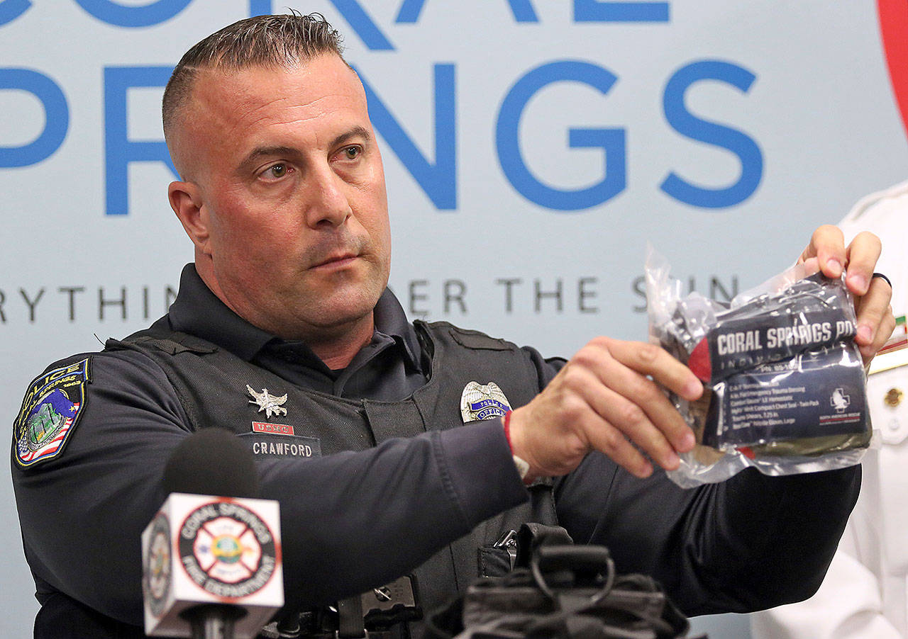 Coral Springs police officer Chris Crawford displays a combat field dressing kit Friday in Coral Springs, Florida. It is similar to the one he used to dress a student’s wounds while responding to the shootings at Marjory Stoneman Douglas High School. (Amy Beth Bennett/South Florida Sun-Sentinel)