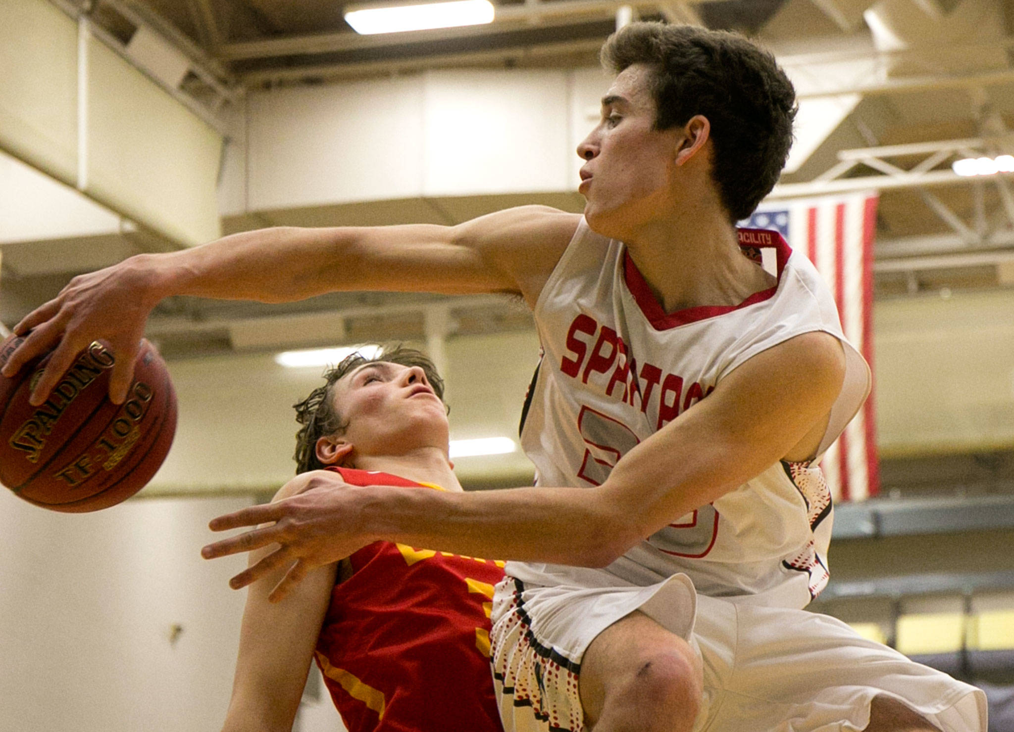 Stanwood’s Nate Kummer attempts a pass with Kamiakin’s Robert Pischel trailing durng a regional playoff game Saturday afternoon at Jackson High School in Mill Creek. (Kevin Clark / The Herald)