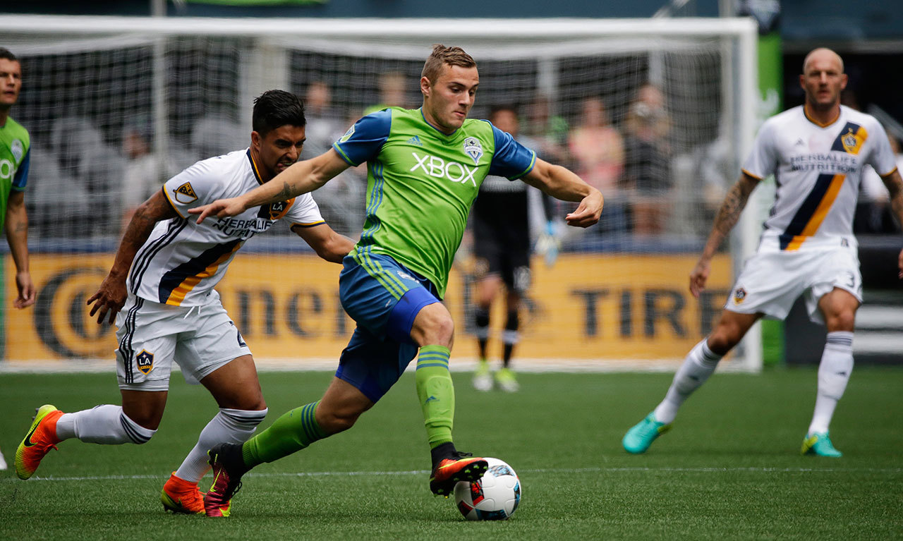 In this July 9, 2016, file photo, Seattle Sounders forward Jordan Morris (center) dribbled the ball during an MLS match against the Los Angeles Galaxy in Seattle. Morris will miss the 2018 season with a knee injury. (AP Photo/Ted S. Warren, File)