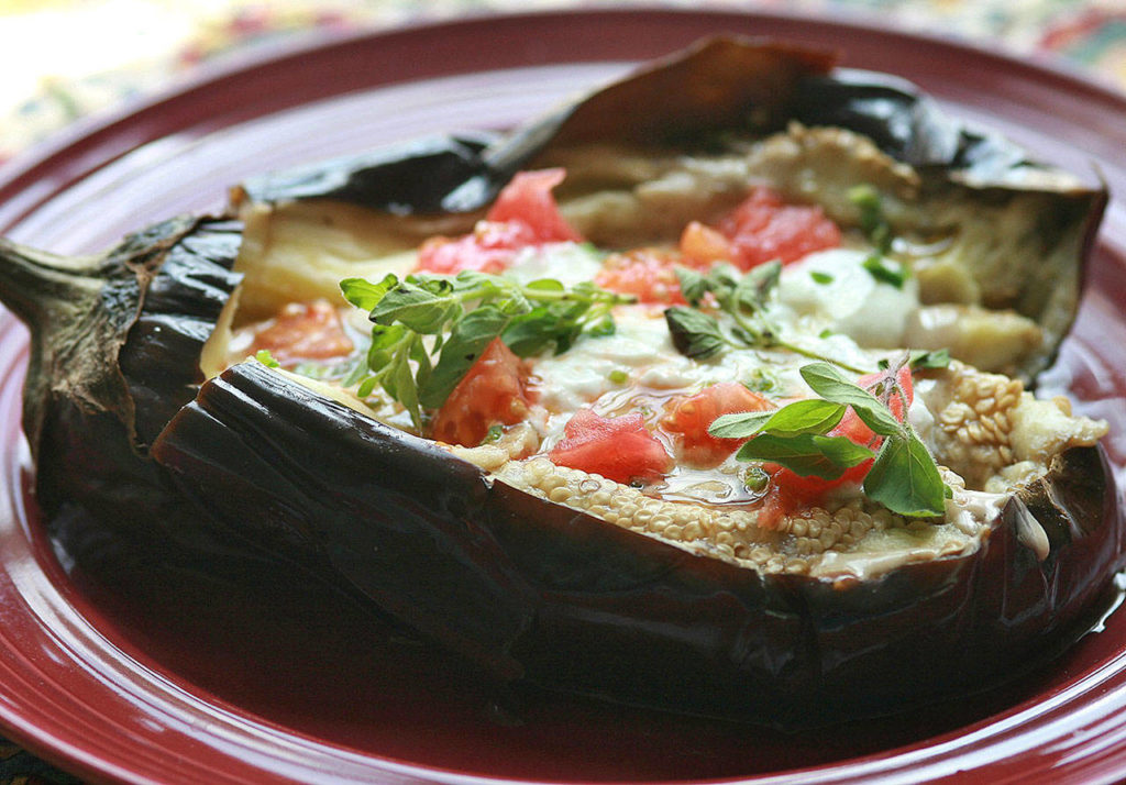 Eggplant carpaccio features a roasted eggplant that is split open and then filled with lots of goodies. (Hillary Levin/St. Louis Post-Dispatch)
