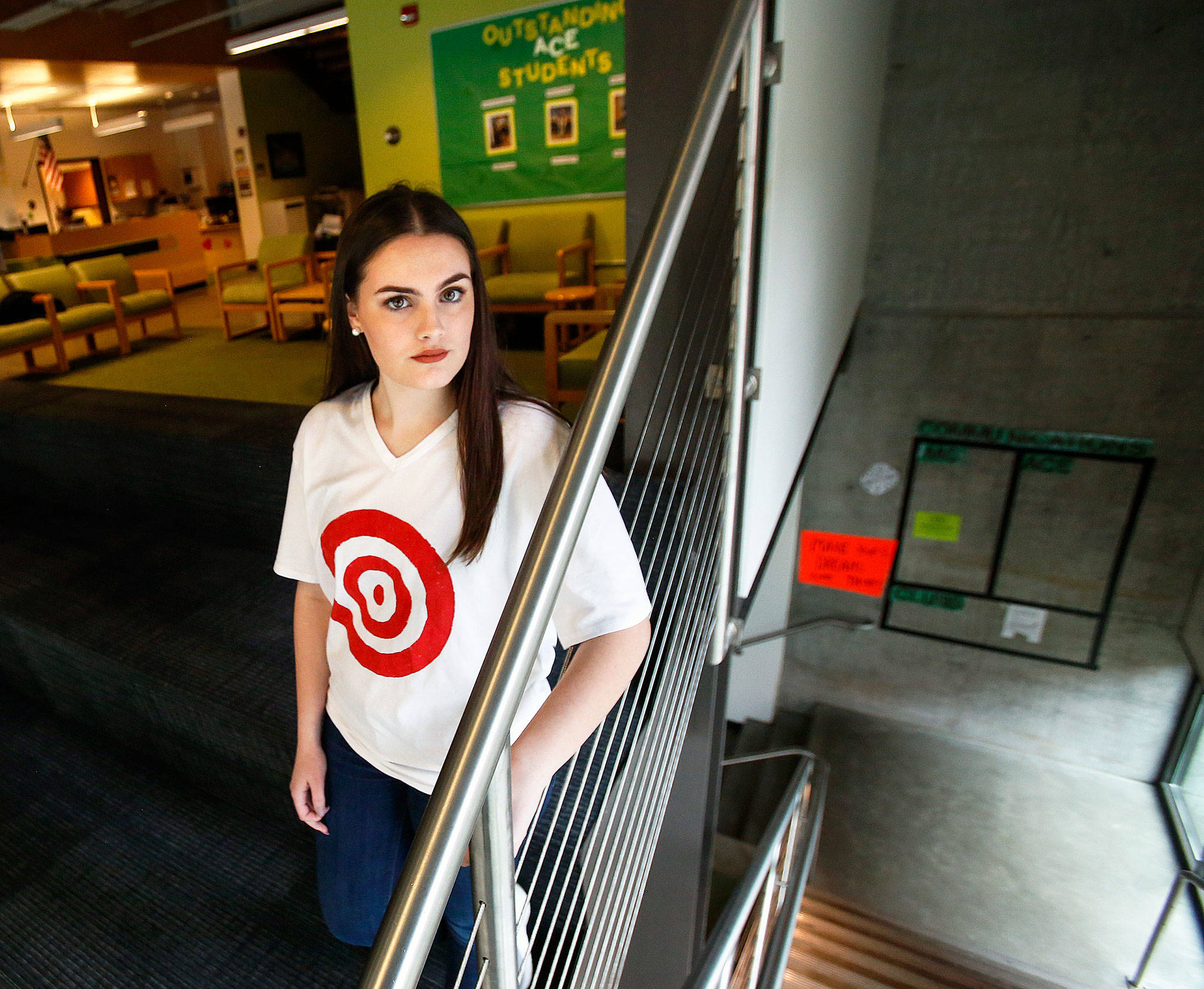 Marysville Getchell High School junior Bailey Thoms has created white T-shirts with messages front and back. The front image is a target while on the back are the words “Are We Next?” Additionally, she has organized a march Saturday to call for gun control and an end to school shootings. (Dan Bates / The Herald)