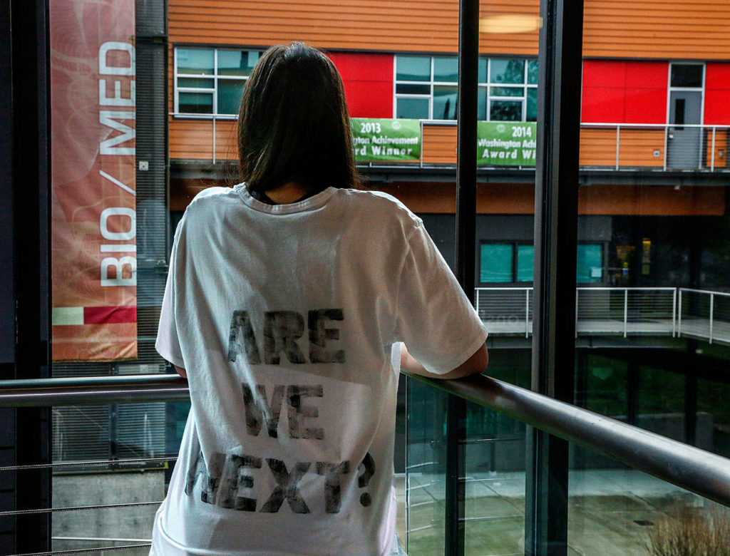 Marysville Getchell High School junior Bailey Thoms has created white T-shirts with messages front and back. The front is a graphic image of a target. Additionally, she has organized a march Saturday to call for gun control and an end to school shootings. (Dan Bates / The Herald)

