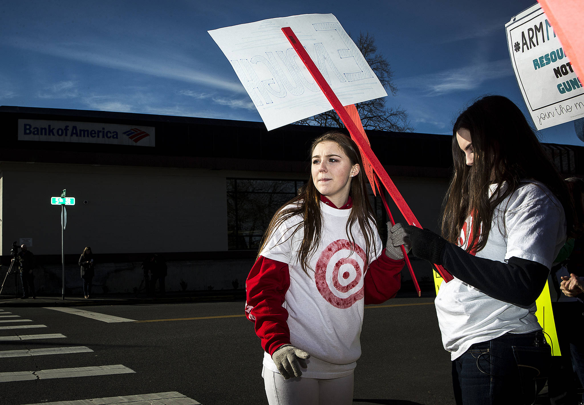 Mikaylah Himmelberger, a junior at Marysville Getchell High School, marches along with other students who organized a rally Saturday in Marysville calling for more mental healthcare support and increased gun regulations. Many students in attendance wore shirts with targets that had “Are we next?” printed on the back. (Ian Terry / The Herald)