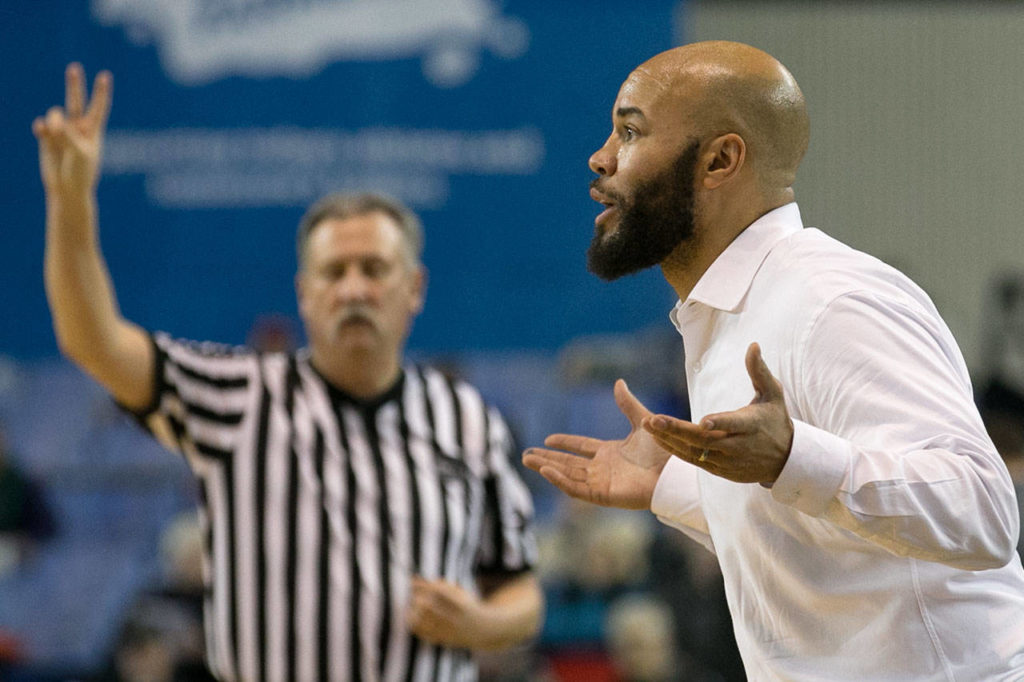 Kamiak’s head coach, Cory West, addresses his team against Union High during the WIAA state basketball tournament Wednesday at the Tacoma Dome in Tacoma on February 28, 2018. (Kevin Clark / The Daily Herald)