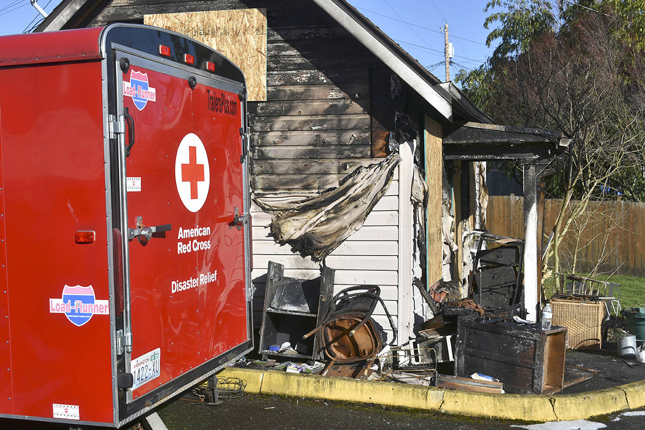 An Everett house fire left one woman dead late Wednesday on Lombard Avenue, according to the local branch of the Red Cross. (Caleb Hutton / The Herald)