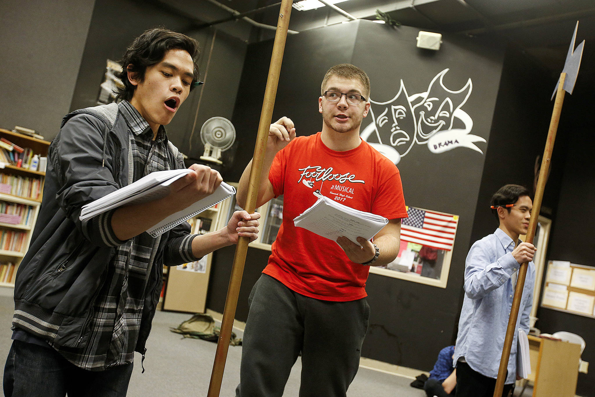 Kamiak High School students (from left) Teddy Kouthong, Jack Burrows and Eddie Kouthong practice lines from “Spamalot”after school on Thursday in Mukilteo. (Ian Terry / The Herald)
