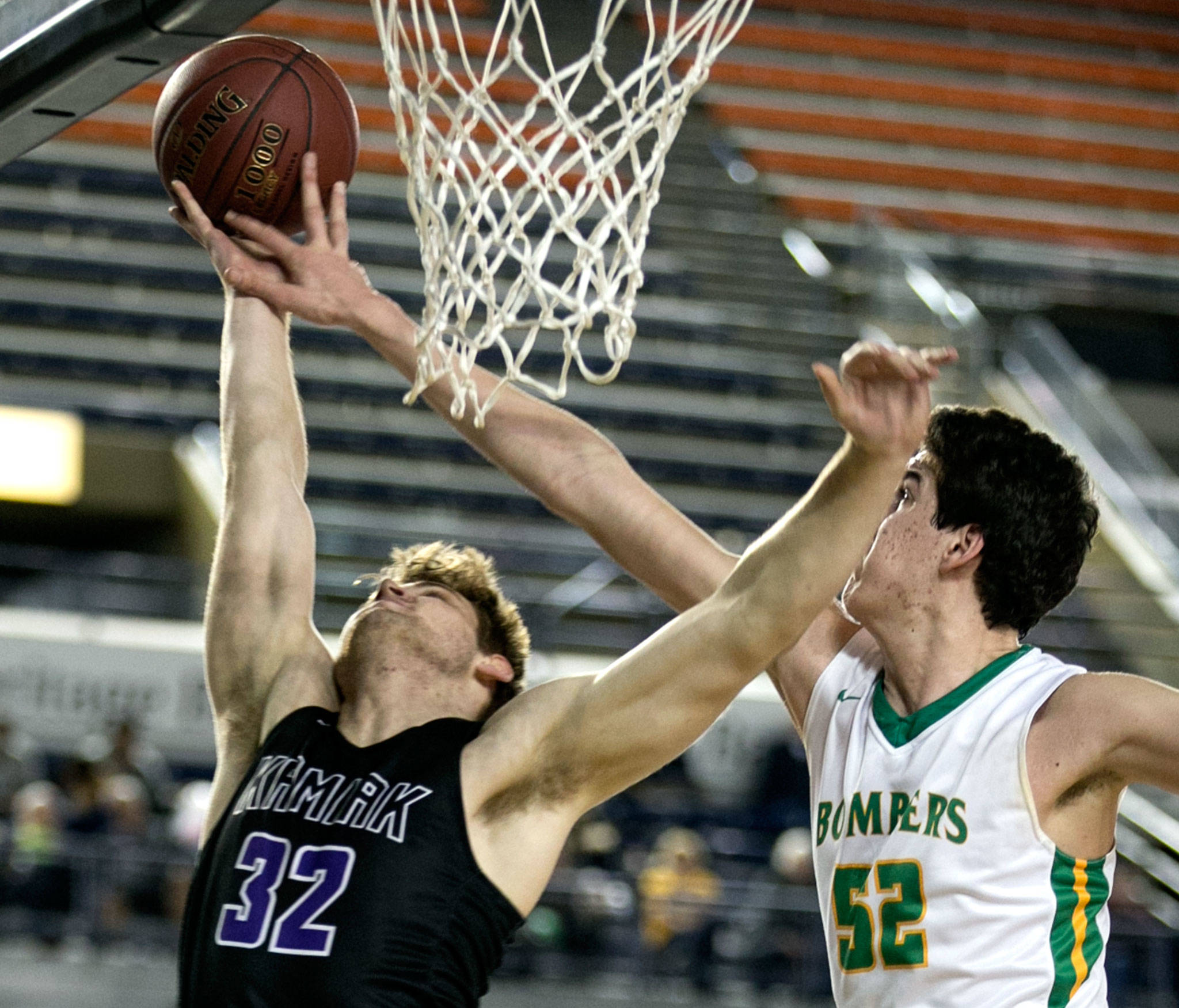 Kamiak’s Braden Leary has his shot blocked by Richland’s Riley Sorn during a 4A boys Hardwood Classic game on March 1, 2018, at the Tacoma Dome. (Kevin Clark / The Herald)