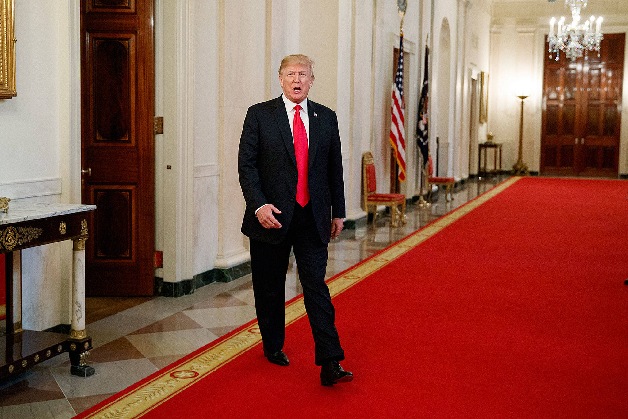 President Donald Trump arrives to speak to the White House Opioid Summit in the East Room of the White House on Thursday. (AP Photo/Evan Vucci)