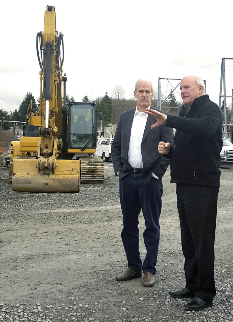 Noah Haglund / The Herald 
Community Transit CEO Emmett Heath (right) and U.S. Rep. Rick Larsen, D-Wash., tour the Seaway Transit Center across from the main employee parking lot at the Boeing Co.’s Everett plant. The facility is set to open next year as part of the new Swift Green Line to Canyon Park in Bothell.
