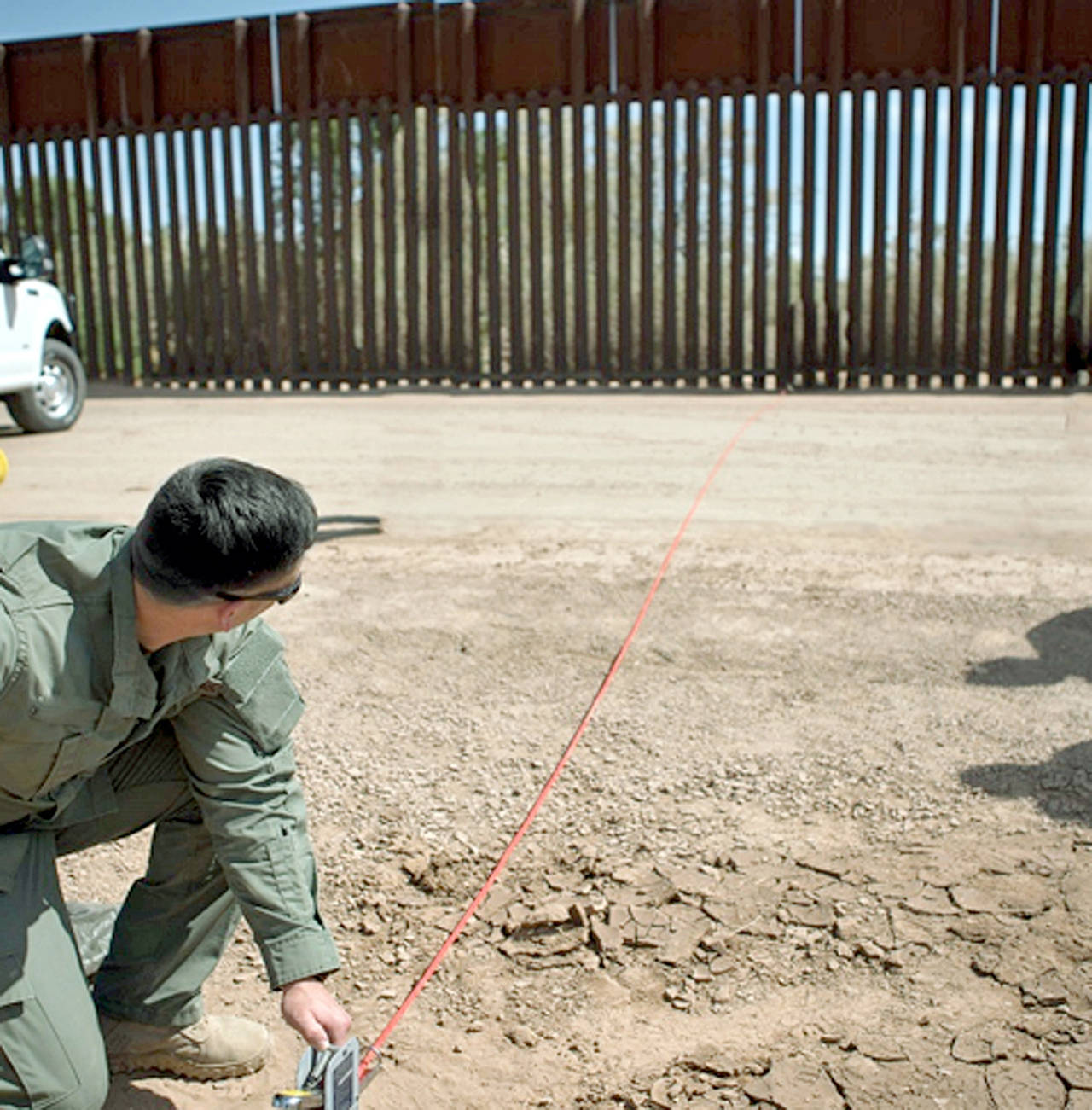 A Border Patrol agent shows the path of a tunnel that crosses the U.S.-Mexico border near Calexico, California. (U.S. Customs and Border Protection via AP, file)