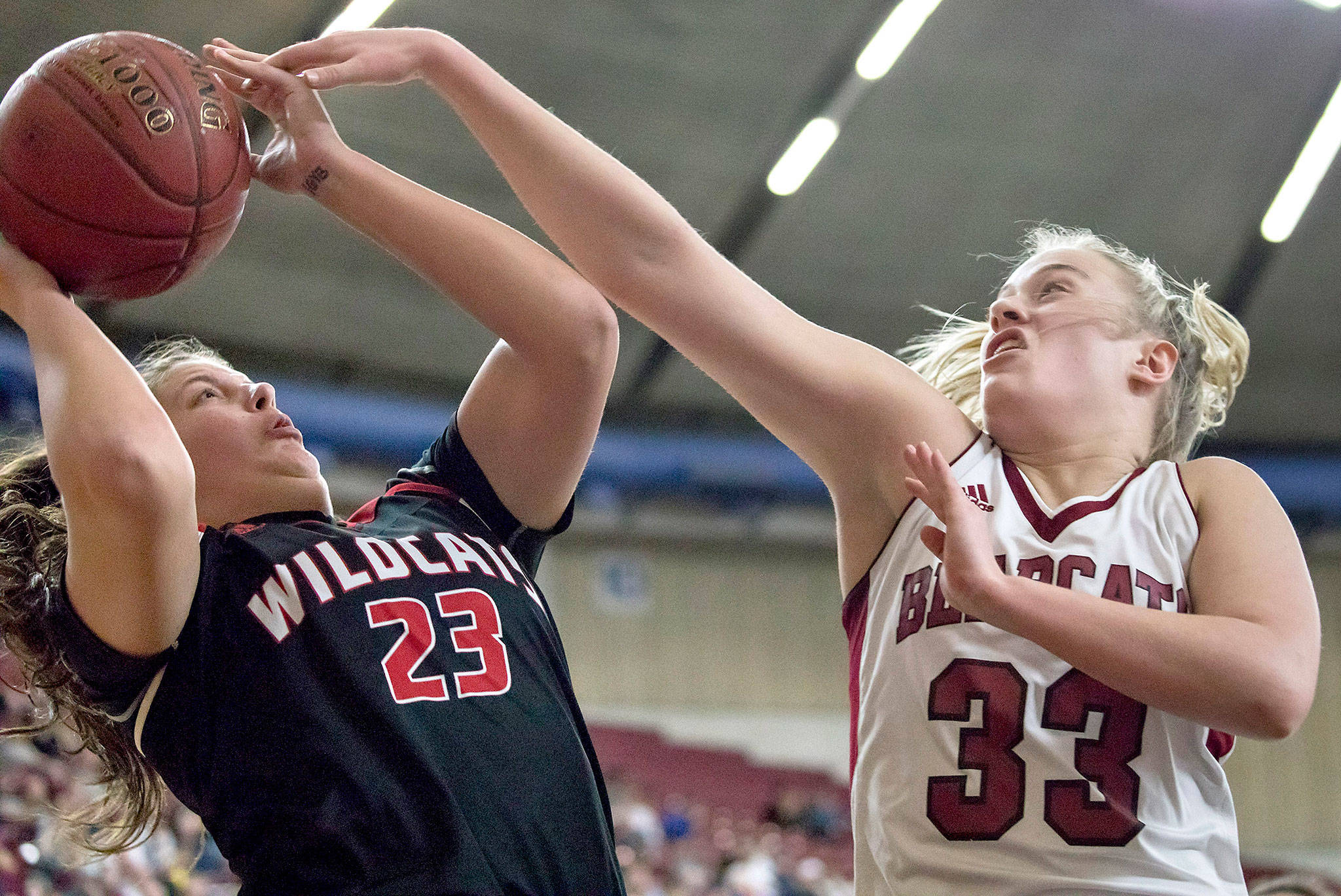 Archbishop Murphy’s Natalie Hayward (23) scores over W.F. West’s Annika Waring (33) in the championship game of the 2A girls Hardwood Classic on March 3, 2018, at the Yakima Valley SunDome. W.F. West defeated Archbishop Murphy 64-52. (TJ Mullinax / for The Herald)