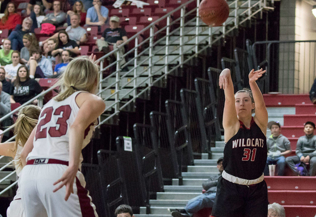 Archbishop Murphy’s Audrey Graham (31) hits a wide open 3-point shot against W.F. West in the 2A girls Hardwood Classic championship game on March 3, 2018, at the Yakima Valley SunDome. W.F. West defeated Archbishop Murphy 64-52. (TJ Mullinax / For The Herald)
