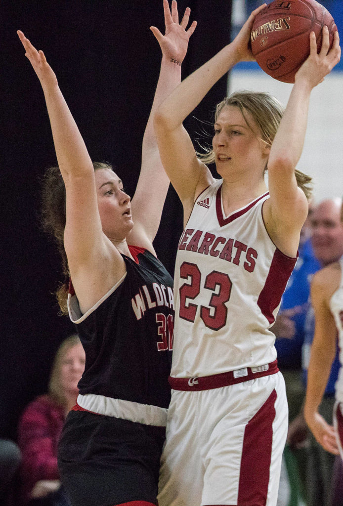 Archbishop Murphy’s Audrey Graham (31) defends against W.F. West’s Erika Brumfield (23) in the 2A girls Hardwood Classic championship game on March 3, 2018, at the Yakima Valley SunDome. W.F. West defeated Archbishop Murphy 64-52. (TJ Mullinax / For The Herald)
