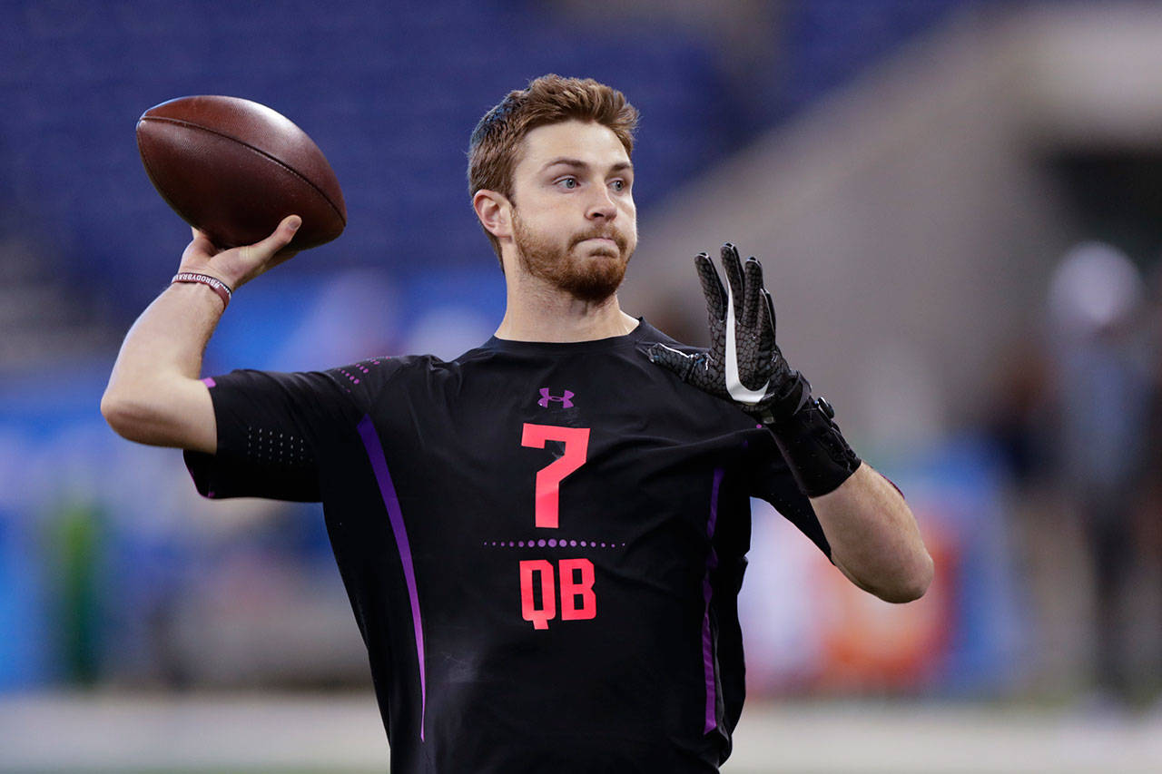 Former Washington State quarterback Luke Falk throws during a drill at the NFL scouting combine in Indianapolis on Saturday. (AP Photo/Michael Conroy)