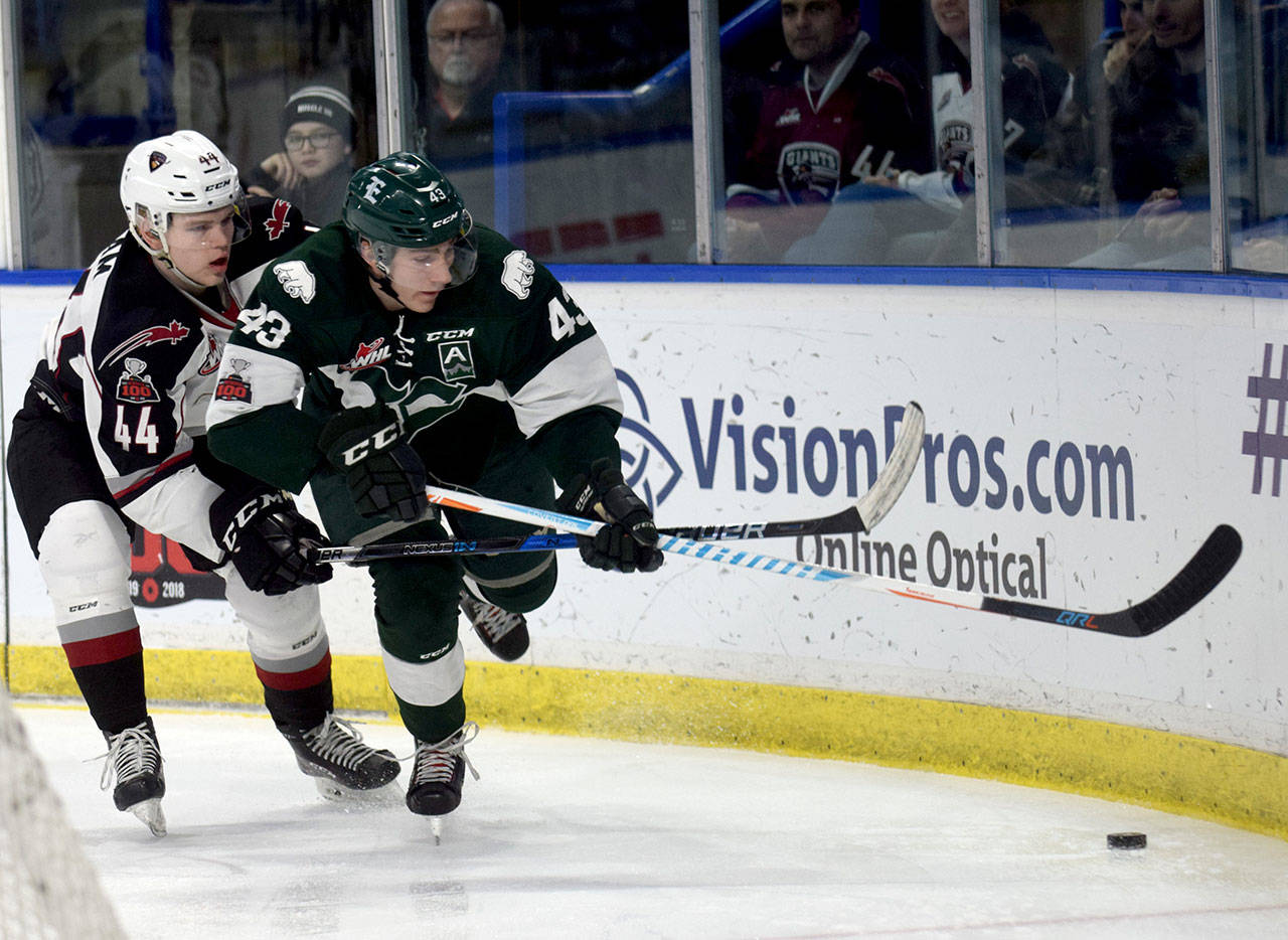Everett’s Connor Dewar (43) and Vancouver’s Bowen Byram race to the puck during Sunday’s game in Langley, Britich Columbia. (Abbotsford News photo)