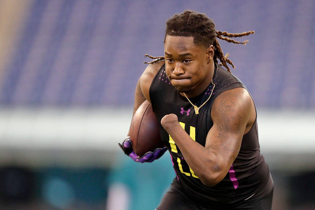 Central Florida linebacker Shaquem Griffin runs through a drill at the NFL scouting combine Sunday in Indianapolis. (AP Photo/Michael Conroy)
