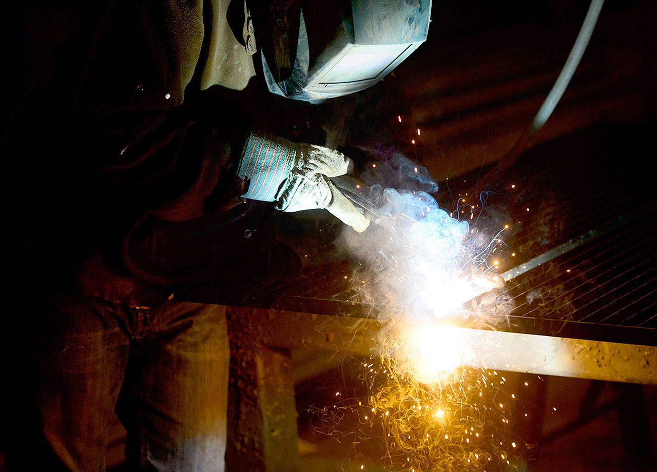 A welder fabricates a steel structure at an iron works facility in Ottawa, Ontario, on Monday. (Sean Kilpatrick/The Canadian Press via AP)