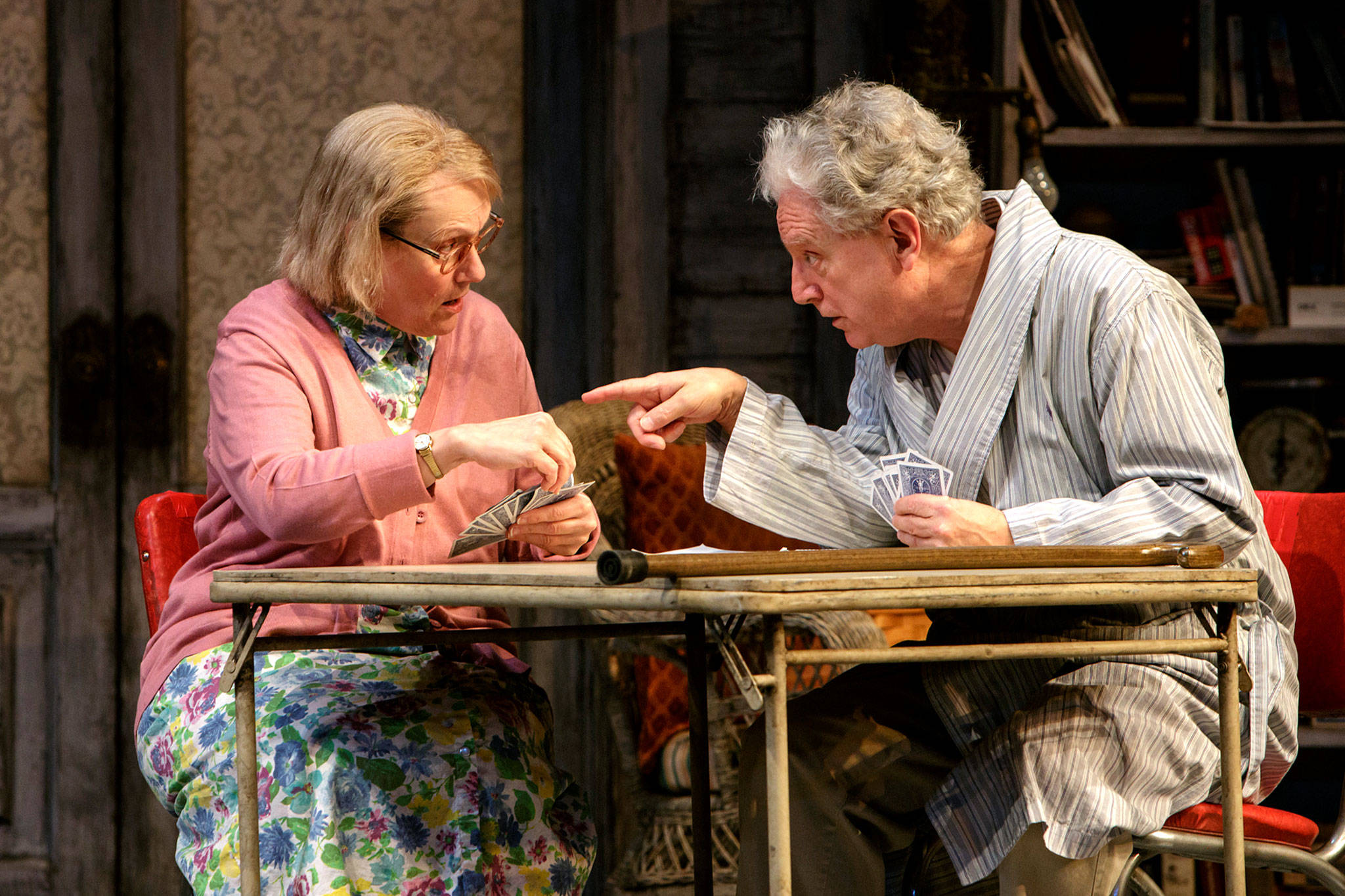 Marianne Owen and Kurt Beattie play a hand of cards and share life stories in “The Gin Game.” (Village Theater photo)