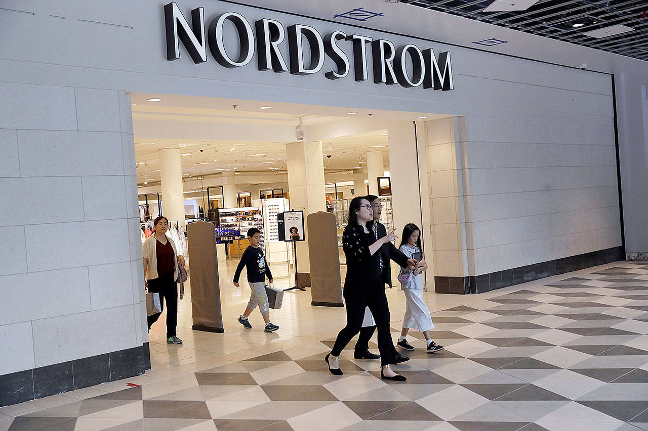 Shoppers exit a Nordstrom store in San Jose, California, in August. (AP Photo/Marcio Jose Sanchez)