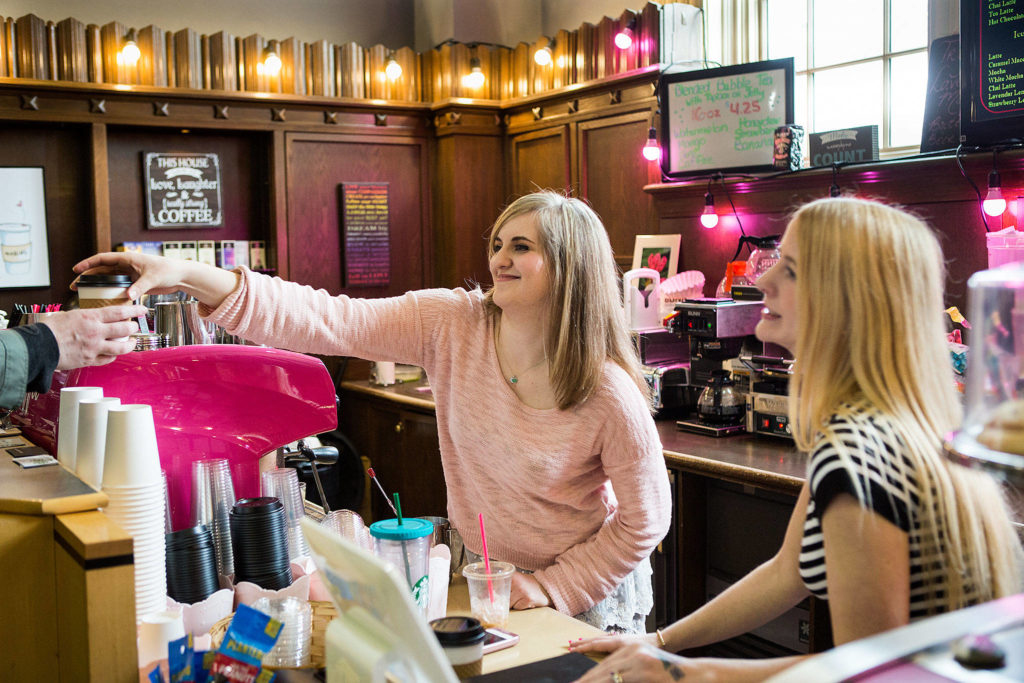 Tabitha Tarter and her mother, Starla Tarter, serve up coffee and food at Tabby’s Coffee in the Everett Public Library. (Andy Bronson / The Herald)
