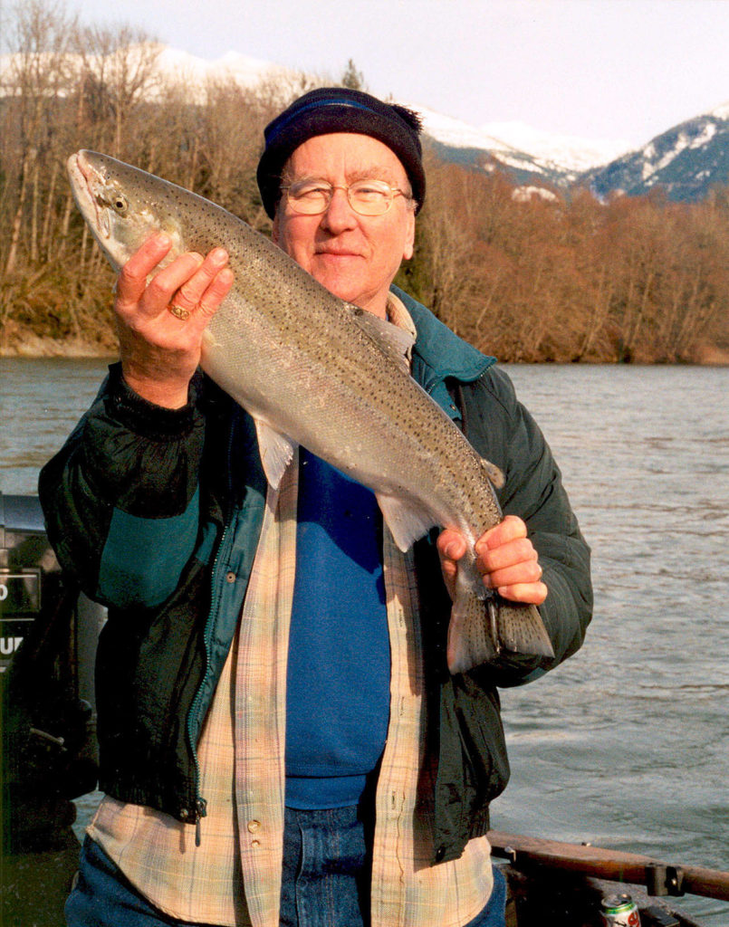 Wayne Kruse displays a freshly-caught Steelhead trout on Dec. 27, 2005. (Photo courtesy of Wayne Kruse)
