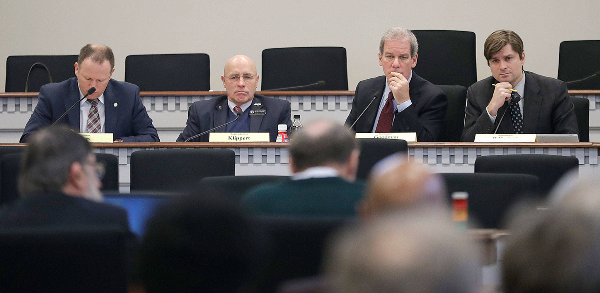 Members of the state House Public Safety committee listen to testimony Tuesday in Olympia. From left: Rep. Dave Hayes R-Camano Island; Rep. Brad Klippert, R-Kennewick; chairman Rep. Roger Goodman, D-Kirkland; and Rep. Mike Pellicciotti, D-Federal Way. (AP Photo/Ted S. Warren)