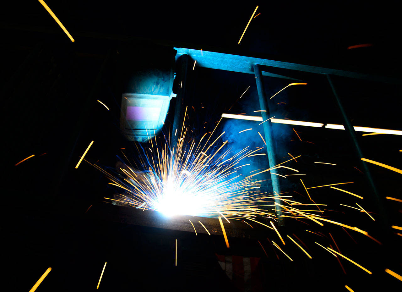 A welder fabricates a steel structure at an iron works facility in Ottawa, Ontario, on Monday. President Donald Trump insisted Monday that he’s “not backing down” on his plan to impose stiff tariffs on imported steel and aluminum. But the tariffs could launch a trade war that would be felt in Wasahington state (Sean Kilpatrick/The Canadian Press via AP)