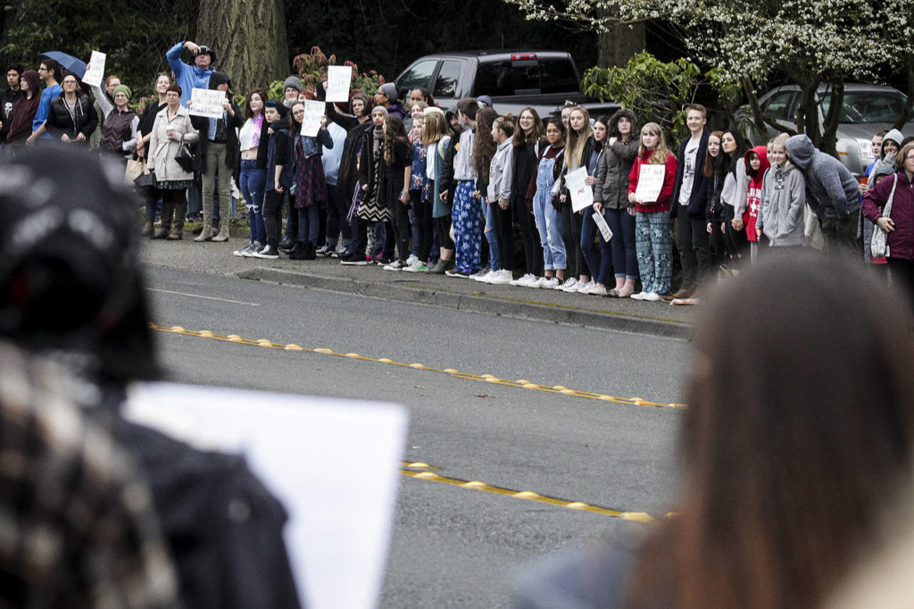 Students who walked out of class line 100th Avenue West in Edmonds on Wednesday. (Ian Terry / The Herald)
