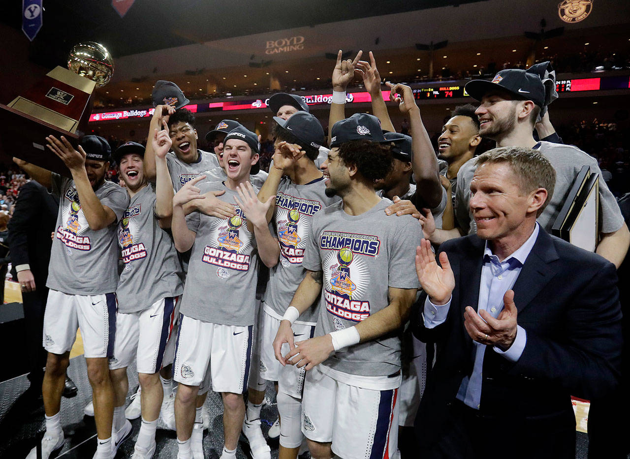 Gonzaga celebrates after winning the West Coast Conference tournament championship Tuesday in Las Vegas. Gonzaga defeated BYU 74-54. (AP Photo/Isaac Brekken)