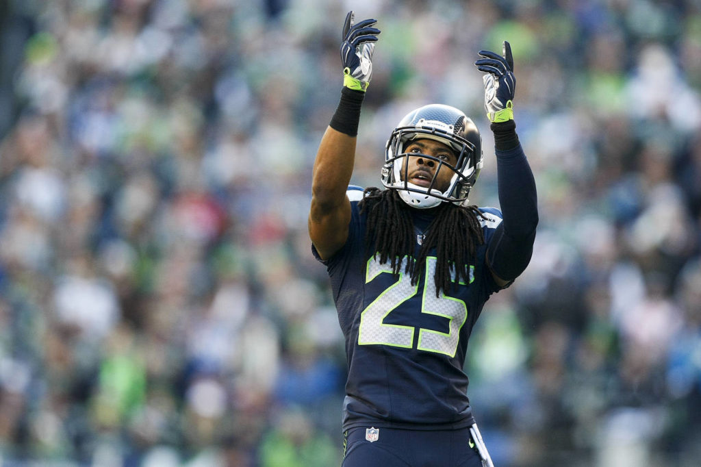 Seahawks cornerback Richard Sherman celebrates a play at CenturyLink Field in Seattle on Sunday, Dec. 14, 2014. (Ian Terry / The Herald)
