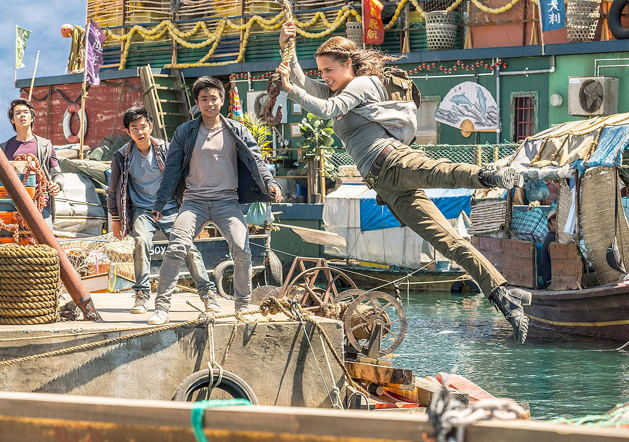 Lara Croft (Alicia Vikander) swings into action in Tomb Raider. (Warner Bros. Pictures / Metro-Goldwyn-Mayer Pictures)
