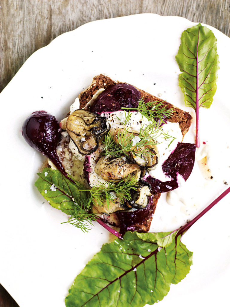 Smoked oysters with beets, horseradish, creme fraiche and dill is served on rye toast. (Andrew Montgomery)
